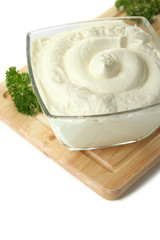 Sour cream in bowl close-up