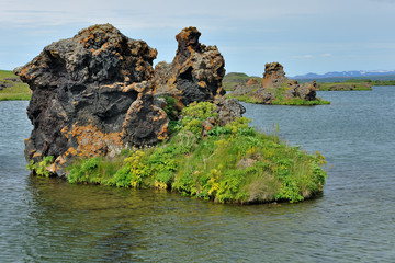 Iceland - lava rocks in Myvatn lake