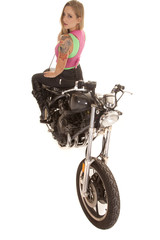 woman tattoo motorcycle sit backwards top view