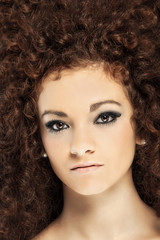 Beauty portrait of curly hair woman