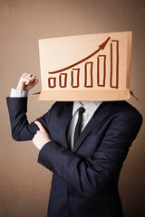 Businessman gesturing with a cardboard box on his head with diag
