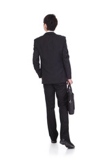 Obraz na płótnie Canvas back view of a business man walking