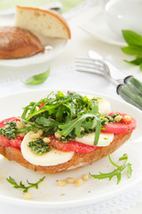 Ciabatta with tomato, mozzarella and rocket salad