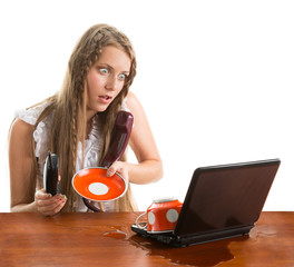 Girl spill coffe to the notebook