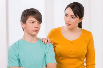 Mother and problem child. Frustrated mother trying to talk with