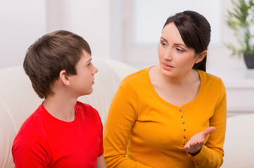 Mother and problem child. Frustrated mother talking to with her
