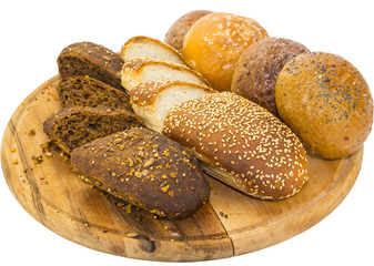 bread and buns on wooden plate