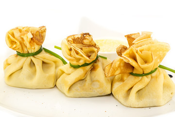 pancakes with meat on a table in a restaurant