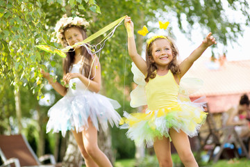 Fototapeta premium Two cute young sisters as the ballet dancers