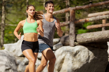 Young sporty couple is doing running exercises