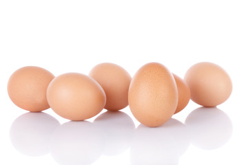 Half dozen  brown chicken eggs isolated on white background