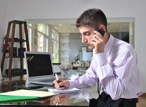 Young Bussinessman Talking With Phone