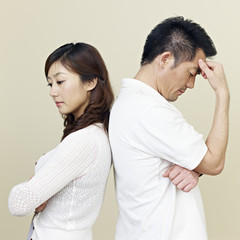young asian couple having relationship difficulties