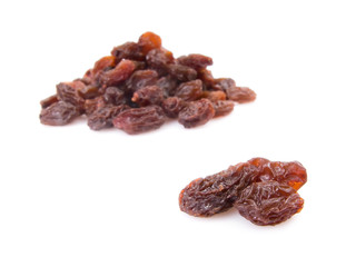 Pile of raisins isolated on white background.