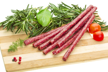 Salami with rosemary, basil and tomato