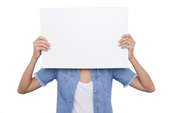 Girl holding a blank signboard front of her face