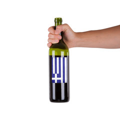 Hand holding a bottle of red wine