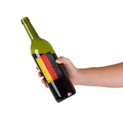 Hand holding a bottle of red wine