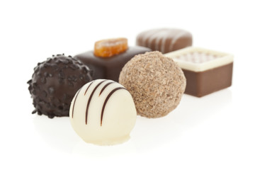 Gourmet chocolate bonbons isolated on white background