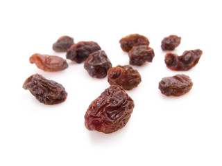 Twelve raisins for New Year wish isolated on white.