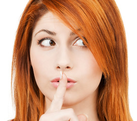 Naklejka premium woman with finger on her lips