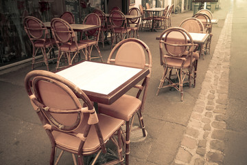 Fototapeta na wymiar Street view of a coffee terrace with tables and chairs