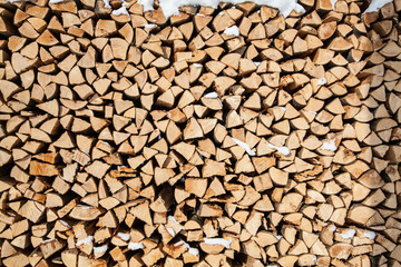 pile of firewood. snowy firewoods in winter forest