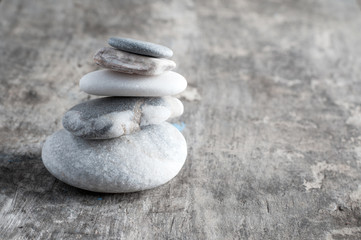 zen rocks on old wooden plank