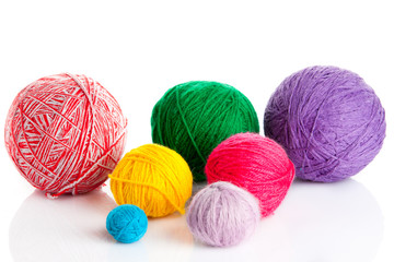 colorful different thread balls. wool knitting on white backgrou