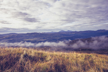 Mist rolling across mountain landscape