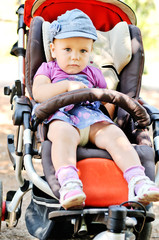 cute baby girl in stroller