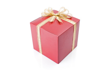 Obraz premium Red gift with a golden bow isolated on white background.