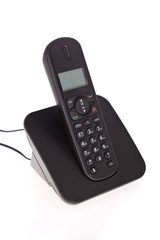 Obraz premium Black cordless phone isolated on white background