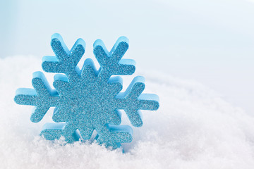 blue christmas snowflake star decoration in snow