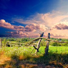 broken wooden fence on the fiald