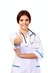 Fototapeta premium Happy yound doctor with thumbs up isolated on white