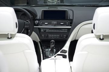 Car Dashboard With White Leather Seats