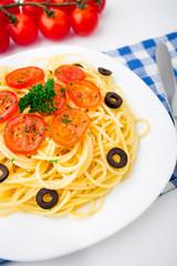 Pasta sliced with cherry tomatoes