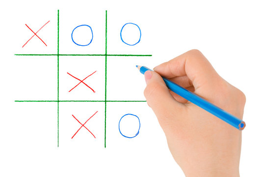 Hand with pencil and game