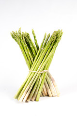 A bunch of fresh asparagus spears tied with twine isolated on a