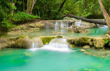 Fototapeta na wymiar Blue stream waterfall in Kanjanaburi Thailand (Erawan waterfall