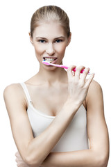happy young blond woman with toothbrush