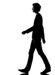 young man silhouette sad walking