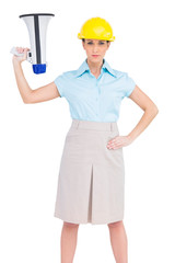 Serious attractive architect holding megaphone
