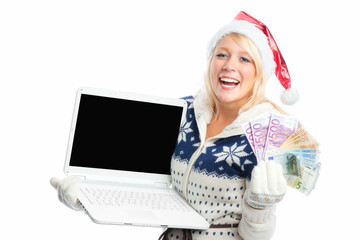 Weihnachtsfrau mit Laptop und Geldscheinen