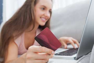 Woman on the sofa doing online shopping