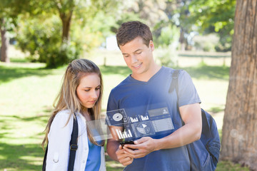 Smiling college friends using digital phone