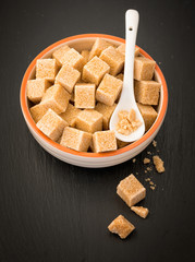 Brown sugar cubes in a ceramic dish