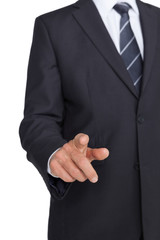 Businessman in suit pointing finger