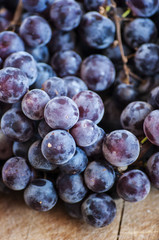 Grapes on a old wooden table.